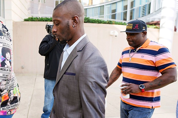 Michael Corey Jenkins, left, and Eddie Terrell Parker enter the Thad Cochran United States Courthouse in Jackson, Mississippi.
Mandatory Credit:	Rogelio V. Solis/AP via CNN Newsource