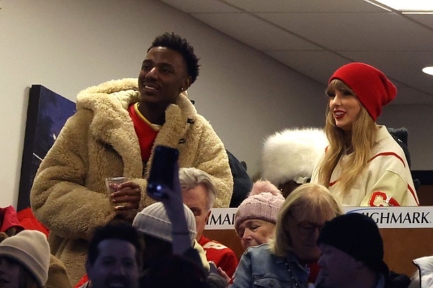 Jerrod Carmichael and Taylor Swift at an NFL game in January.
Mandatory Credit:	Al Bello/Getty Images via CNN Newsource