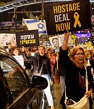 Demonstrators call for the release of Israeli hostages being held by Hamas during a protest in Tel Aviv on March 17, 2024.
Mandatory Credit:	Carlos Garcia Rawlins/Reuters via CNN Newsource