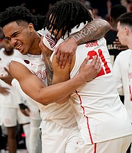 Houston guard Ramon Walker Jr. (left) and guard Emanuel Sharp celebrate the team's win over Texas A&M at March Madness.
Mandatory Credit:	George Walker IV/AP via CNN Newsource
