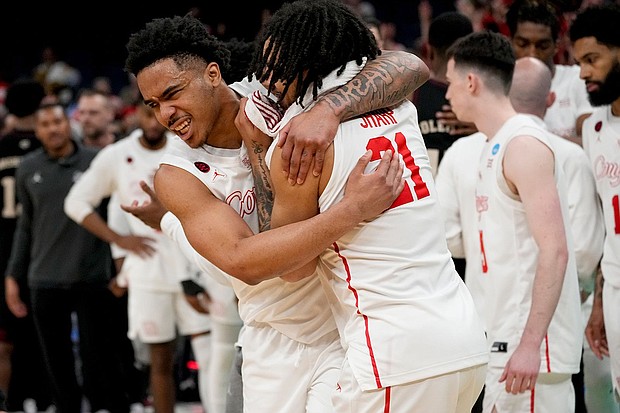 Houston guard Ramon Walker Jr. (left) and guard Emanuel Sharp celebrate the team's win over Texas A&M at March Madness.
Mandatory Credit:	George Walker IV/AP via CNN Newsource