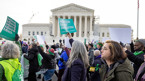 Abortion-rights groups march outside the Supreme Court on Tuesday, March 26, in Washington, DC.
Mandatory Credit:	Amanda Andrade-Rhoades/AP via CNN Newsource