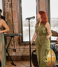 Valen the Valentine (left) and her band perform in the UH-Downtown W.I. Dykes Library
Photo Credit: University of Houston-Downtown