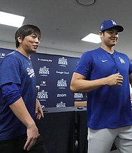 Ippei Mizuhara, left, the interpreter for Los Angeles Dodgers' Shohei Ohtani, right, was fired from the team last week.
Mandatory Credit:	Lee Jin-man/AP via CNN Newsource