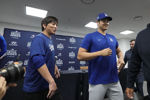 Ippei Mizuhara, left, the interpreter for Los Angeles Dodgers' Shohei Ohtani, right, was fired from the team last week.
Mandatory Credit:	Lee Jin-man/AP via CNN Newsource
