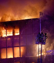 Firefighters respond to the burning Crocus City Hall on March 22.
Mandatory Credit:	Maxim Shemetov/Reuters via CNN Newsource