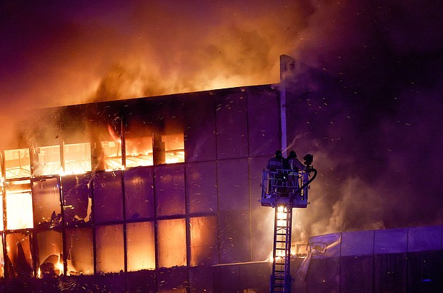 Firefighters respond to the burning Crocus City Hall on March 22.
Mandatory Credit:	Maxim Shemetov/Reuters via CNN Newsource