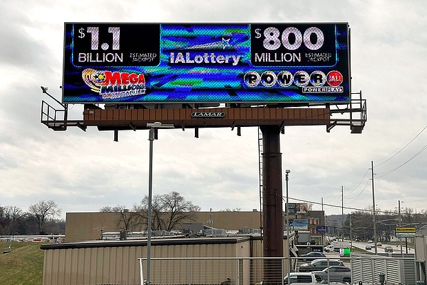 An electronic billboard advertises the Mega Millions and Powerball jackpots, Monday, March 25, in Des Moines, Iowa, that when combined amount to nearly $2 billion.
Mandatory Credit:	Scott McFetridge/AP via CNN Newsource