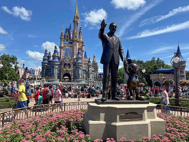 People gather at the Magic Kingdom theme park in Orlando, Florida, in 2022. Disney and Florida have agreed to a settlement.
Mandatory Credit:	Octavio Jones/Reuters/File via CNN Newsourc