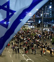 People block a road during a demonstration calling for the return of hostages held in Gaza since October 7, in Tel Aviv, Israel March 26.
Mandatory Credit:	Carlos Garcia Rawlins/Reuters via CNN Newsource