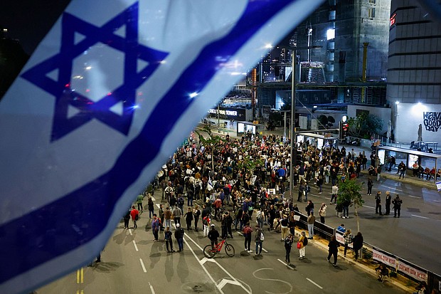 People block a road during a demonstration calling for the return of hostages held in Gaza since October 7, in Tel Aviv, Israel March 26.
Mandatory Credit:	Carlos Garcia Rawlins/Reuters via CNN Newsource