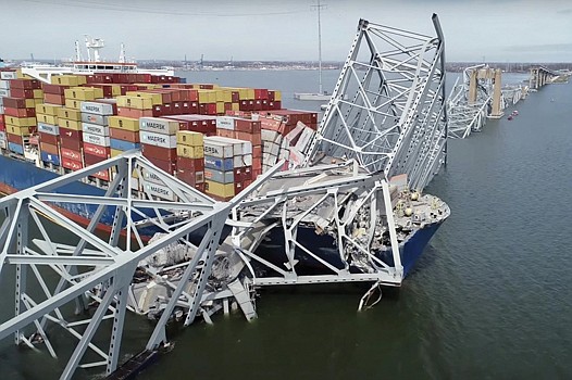 The collapsed Francis Scott Key Bridge over the Patapsco River in Baltimore on Tuesday. The bridge fell after the cargo ship Dali lost power and rammed a bridge support.