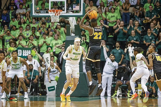 VCU’s Joe Bamisile unloads a shot in the Rams’ 70-65 win at South Florida in the NIT second round.