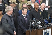 From left, Sen. Chris Van Hollen (D-Md.), Bill DelBagno,
FBI special agent in charge of the Baltimore field office,
Maryland Gov. Wes Moore and Paul J. Wiedefeld, Maryland’s
transportation secretary, hold a news conference near the
scene where a container ship collided with a support on
the Francis Scott Key Bridge on Tuesday in Baltimore. The
major bridge in Baltimore snapped and collapsed after a
container ship rammed into it early Tuesday, and several
vehicles fell into the river below.