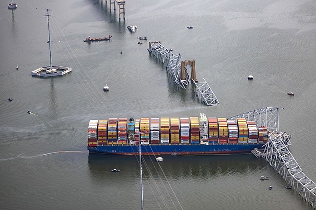 In an aerial view, the cargo ship Dali sits in the water after running into and collapsing the Francis Scott Key Bridge on March 26, in Baltimore, Maryland.
Mandatory Credit:	Tasos Katopodis/Getty Images via CNN Newsource