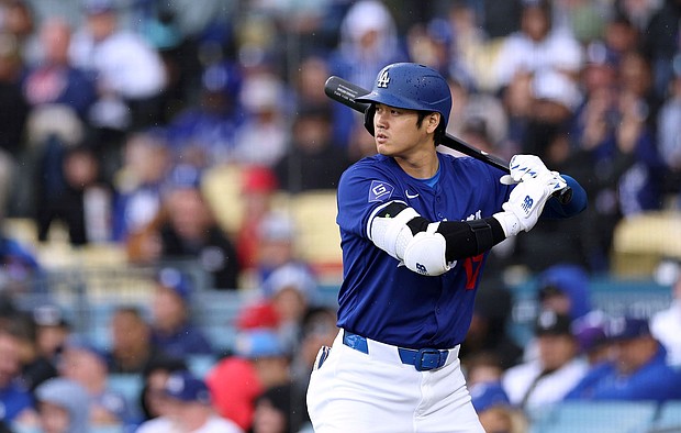 Ohtani prepares for a pitch during the Dodgers' preseason game against the Los Angeles Angels.
Mandatory Credit:	Harry How/Getty Images via CNN Newsource