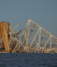 Demolition workers could open a channel for ships to move in and out of the Port of Baltimore as soon as May. A view of the Francis Scott Key Bridge, after the Dali cargo vessel crashed into it causing it to collapse, is pictured in Baltimore, Maryland, March 26.
Mandatory Credit:	Julia Nikhinson/Reuters via CNN Newsource