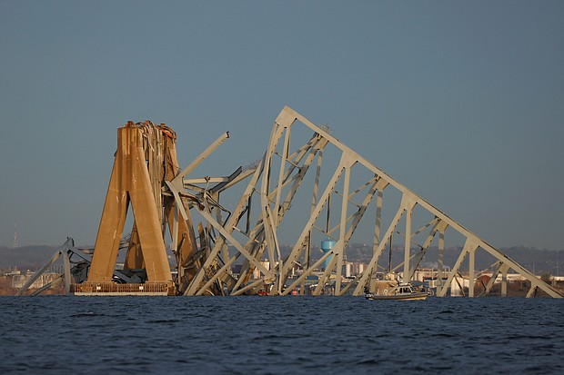 Demolition workers could open a channel for ships to move in and out of the Port of Baltimore as soon as May. A view of the Francis Scott Key Bridge, after the Dali cargo vessel crashed into it causing it to collapse, is pictured in Baltimore, Maryland, March 26.
Mandatory Credit:	Julia Nikhinson/Reuters via CNN Newsource
