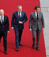 German Chancellor Olaf Scholz, Polish Prime Minister Donald Tusk and French President Emmanuel Macron in Berlin, Germany, March 15.
Mandatory Credit:	Odd Andersen/AFP/Getty Images via CNN Newsource