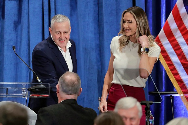 Newly-elected Chairman Michael Whatley, left, and Co-Chair Lara Trump, right, greet attendees as they crowd the podium after the general session of the Republican National Committee Spring Meeting, March 8, in Houston.
Mandatory Credit:	Michael Wyke/AP via CNN Newsource