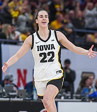 Caitlin Clark of the Iowa Hawkeyes reacts after breaking the NCAA single-season three-point shot record on March 8, in Minneapolis.
Mandatory Credit:	Aaron J. Thornton/Getty Images via CNN Newsource