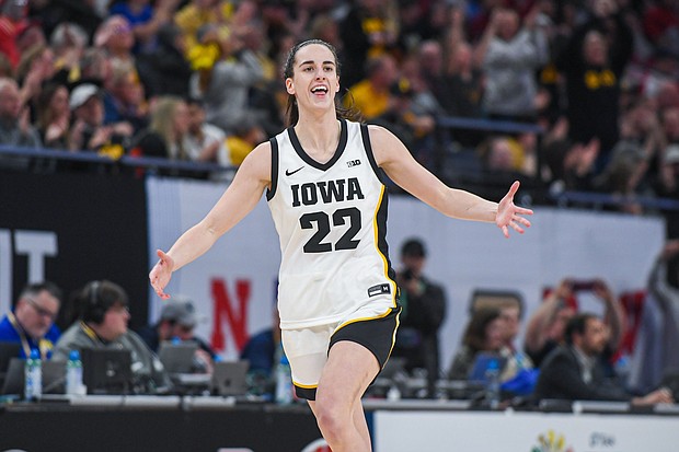 Caitlin Clark of the Iowa Hawkeyes reacts after breaking the NCAA single-season three-point shot record on March 8, in Minneapolis.
Mandatory Credit:	Aaron J. Thornton/Getty Images via CNN Newsource