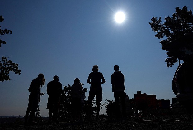 People gather near Redmond, Oregon, in August 2017 to view a total solar eclipse as the celestial event approaches. Shallow cumulus clouds start dissipating in large proportions when only a fraction of the sun is covered, a new study says.
Mandatory Credit:	Ted S. Warren/AP via CNN Newsource