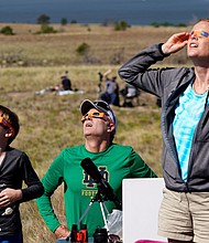 People watch the 2017 total solar eclipse in Guernsey, Wyoming.
Mandatory Credit:	Rick Wilking/Reuters/File via CNN Newsource