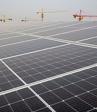 Longi Green Energy Technology Co. solar panels on the roof of an office building in Xi'an, China, pictured in March 2023.
Mandatory Credit:	Bloomberg/Getty Images via CNN Newsource