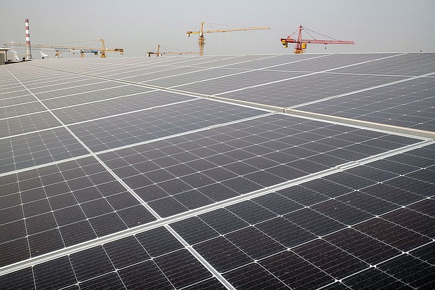 Longi Green Energy Technology Co. solar panels on the roof of an office building in Xi'an, China, pictured in March 2023.
Mandatory Credit:	Bloomberg/Getty Images via CNN Newsource