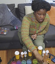 Jazmin Evans, a student at Temple University, prepares her post-kidney transplant medications
at home in Philadelphia on Feb. 16, 2024. Evans had been waiting for a new kidney for four
years when her hospital revealed shocking news: She should have been put on the transplant
list in 2015 instead of 2019 — and a racially biased organ test was to blame.