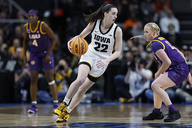 Caitlin Clark of the Iowa Hawkeyes dribbles against Hailey Van Lith of the LSU Tigers at last Monday's NCAA Women's basketball game in Albany, New York.
Mandatory Credit:	Sarah Stier/Getty Images via CNN Newsource