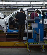 Employees install parts on a Mercedes-Benz SUV as it moves down the production line at its factory in  Vance, Alabama in this 2017 file photo. The United Auto Workers union is seeking an vote to represent the 6,000 hourly workers at the plant.
Mandatory Credit:	Andrew Caballero-Reynolds/AFP/Getty Images via CNN Newsource