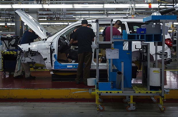 Employees install parts on a Mercedes-Benz SUV as it moves down the production line at its factory in  Vance, Alabama in this 2017 file photo. The United Auto Workers union is seeking an vote to represent the 6,000 hourly workers at the plant.
Mandatory Credit:	Andrew Caballero-Reynolds/AFP/Getty Images via CNN Newsource