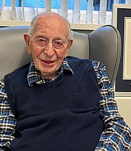 John Alfred Tinniswood, 111, poses with his certificate from Guinness World Records in Southport, England, on Thursday.
Mandatory Credit:	Guinness World Records via Reuters via CNN Newsource
