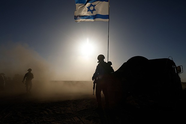Soldiers with the Israel Defense Forces stand near a military vehicle on March 4, 2024.
Mandatory Credit:	Amir Levy/Getty Images via CNN Newsource