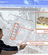 Grossi points on a map of the Zaporizhzhia nuclear power plant, March 2022
Mandatory Credit:	Joe Klamar/AFP/Getty Images/File via CNN Newsource