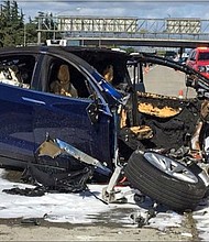 Walter Huang died when his Tesla Model X crashed into a concrete barrier.
Mandatory Credit:	KTVU-TV/AP via CNN Newsource