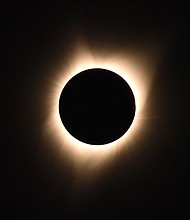 The sun's corona is visible as the moon passes in front of the sun during a total solar eclipse at Big Summit Prairie ranch in Oregon's Ochoco National Forest near the city of Mitchell on August 21, 2017.
Mandatory Credit:	Robyn Beck/AFP/Getty Images via CNN Newsource