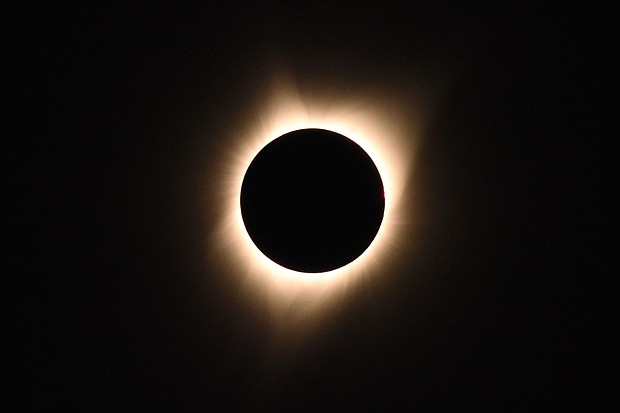 The sun's corona is visible as the moon passes in front of the sun during a total solar eclipse at Big Summit Prairie ranch in Oregon's Ochoco National Forest near the city of Mitchell on August 21, 2017.
Mandatory Credit:	Robyn Beck/AFP/Getty Images via CNN Newsource