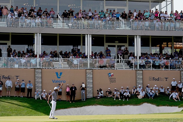 Akshay Bhatia celebrates the birdie putt that forced McCarthy into a playoff, dislocating his shoulder in the process.
Mandatory Credit:	Raj Mehta/Getty Images via CNN Newsource