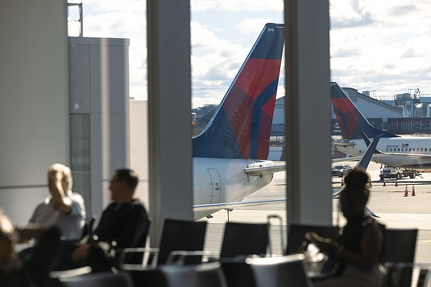 Delta Air Lines planes line up at New York's LaGuardia Airport in an April 2024 photo.
Mandatory Credit:	Angus Mordant/Bloomberg/Getty Images via CNN Newsource