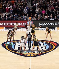 Kamilla Cardoso of the South Carolina Gamecocks and Hannah Stuelke of the Iowa Hawkeyes jump for the tip in the 2024 NCAA Women's Basketball Tournament National Championship. South Carolina beat Iowa 87-75.
Mandatory Credit:	Steph Chambers/Getty Images via CNN Newsource