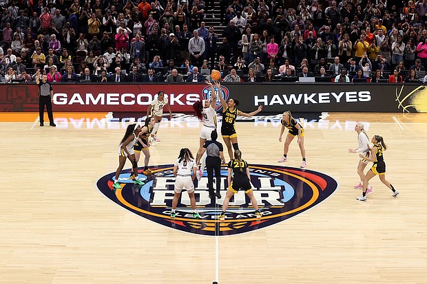 Kamilla Cardoso of the South Carolina Gamecocks and Hannah Stuelke of the Iowa Hawkeyes jump for the tip in the 2024 NCAA Women's Basketball Tournament National Championship. South Carolina beat Iowa 87-75.
Mandatory Credit:	Steph Chambers/Getty Images via CNN Newsource