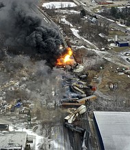 This photo taken with a drone shows portions of a Norfolk Southern freight train that derailed Friday night in East Palestine, Ohio, are still on fire at mid-day on Feb. 4, 2023. The rail company announced it has reached a $600 million settlement with residents affected by the derailment.
Mandatory Credit:	Gene J. Puskar/AP via CNN Newsource