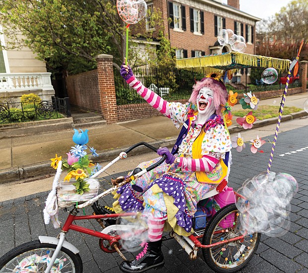 Richmond’s spring tradition, “Easter on Parade,” returned to Monument Avenue between Davis and North Allen avenues on Easter Sunday, March 31.  J Tucker & The Krewe’s performance at the Allen Avenue stage on Monument Avenue was what Natalie White needed to let loose and dance a step or two. (Julianne Tripp/Richmond Free Press)