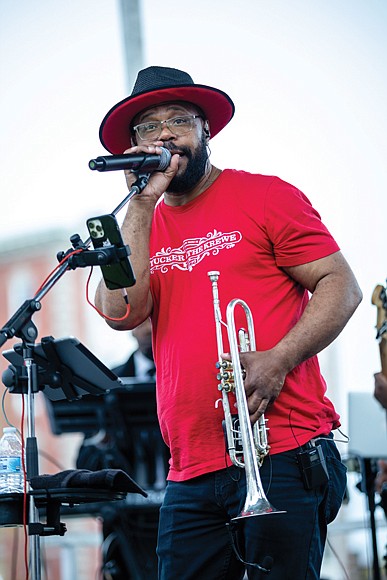 Richmond’s spring tradition, “Easter on Parade,” returned to Monument Avenue between Davis and North Allen avenues on Easter Sunday, March 31.  J Tucker & The Krewe’s performance at the Allen Avenue stage on Monument Avenue was what Natalie White needed to let loose and dance a step or two. (Julianne Tripp/Richmond Free Press)