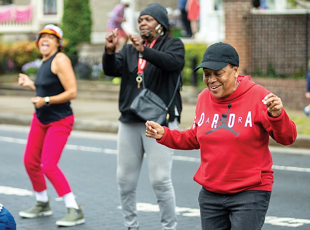 Richmond’s spring tradition, “Easter on Parade,” returned to Monument Avenue between Davis and North Allen avenues on Easter Sunday, March 31.  J Tucker & The Krewe’s performance at the Allen Avenue stage on Monument Avenue was what Natalie White needed to let loose and dance a step or two. (Julianne Tripp/Richmond Free Press)