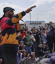 Chris Smalls, president of the Amazon Labor Union, speaks at a rally outside an Amazon
warehouse on Staten Island in New York, April 24, 2022. Within union ranks, some felt
Smalls was spending too much time traveling and giving speeches instead of organizing
workers on Staten Island.