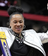 South Carolina head coach Dawn Staley cuts down the net after the Final Four college
basketball championship game against Iowa in the women’s NCAA Tournament, Sunday,
April 7, in Cleveland. South Carolina won 87-75.